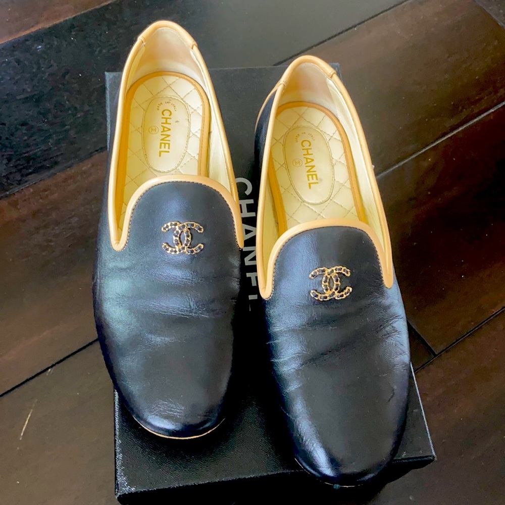 Authentic Chanel Loafers in black with gold and black hardware